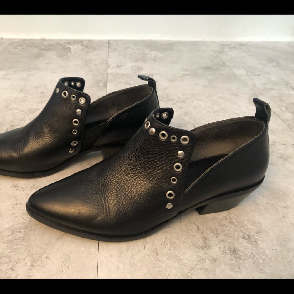 Black Rebecca Minkoff booties with metal rivets.